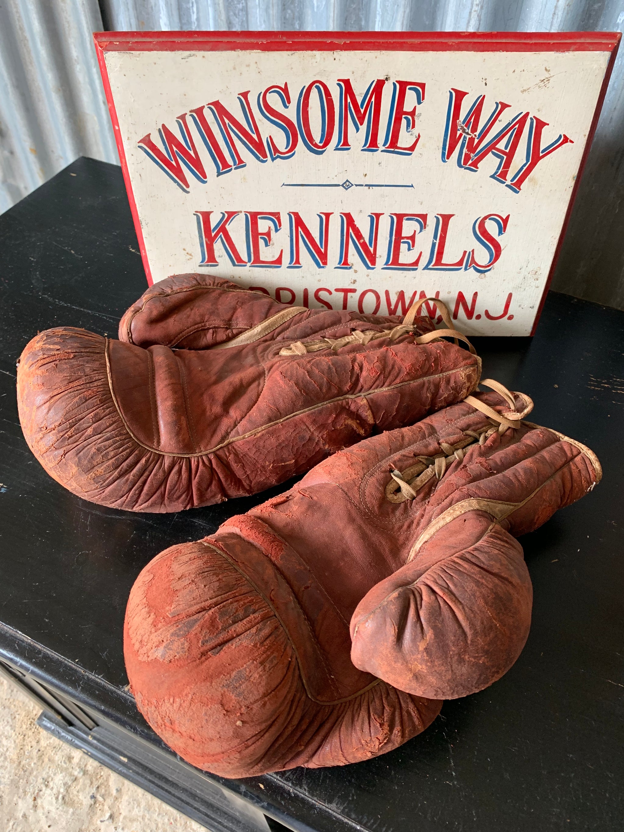 A vintage pair of large red leather Everlast boxing gloves