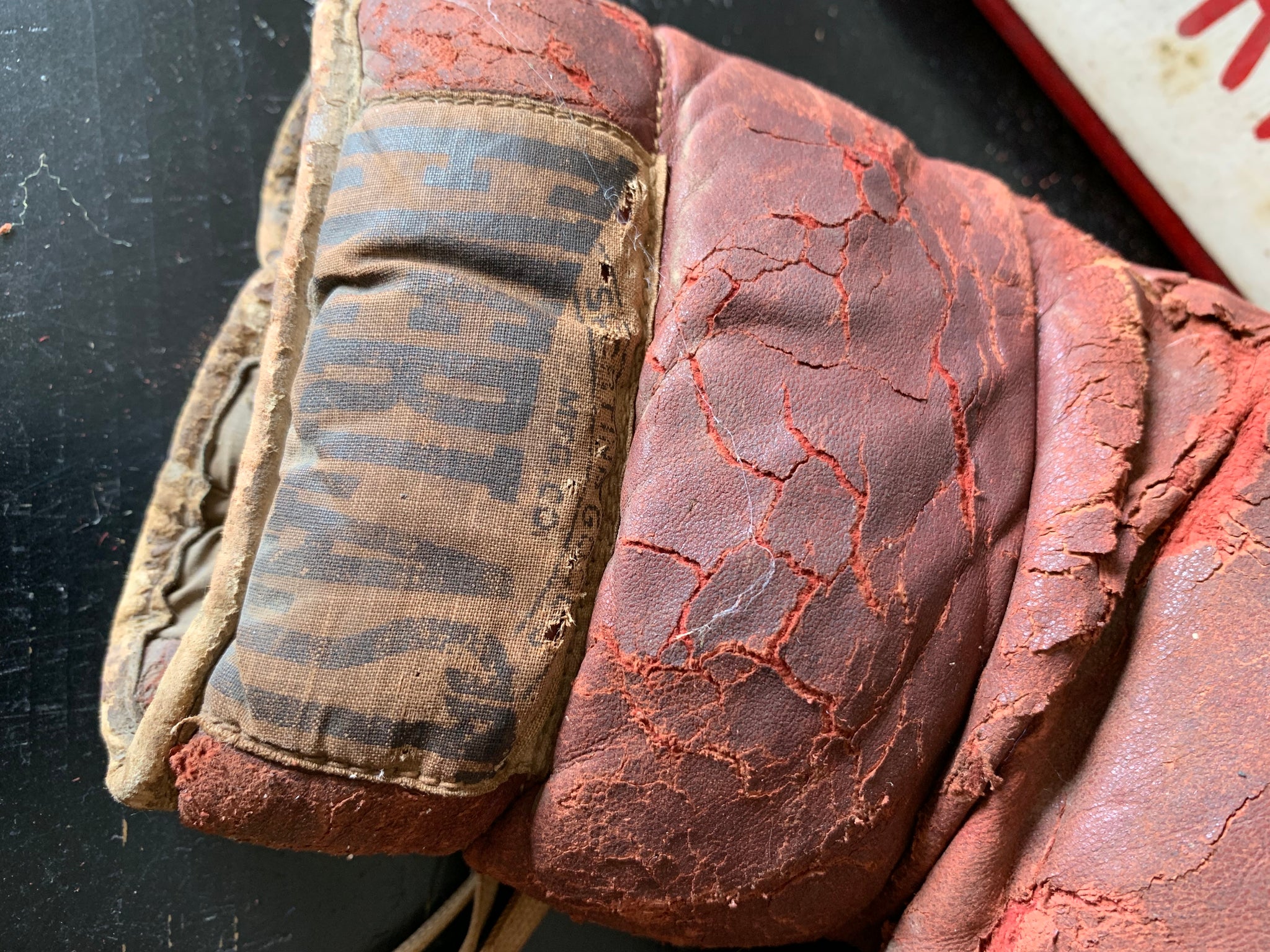 A vintage pair of large red leather Everlast boxing gloves