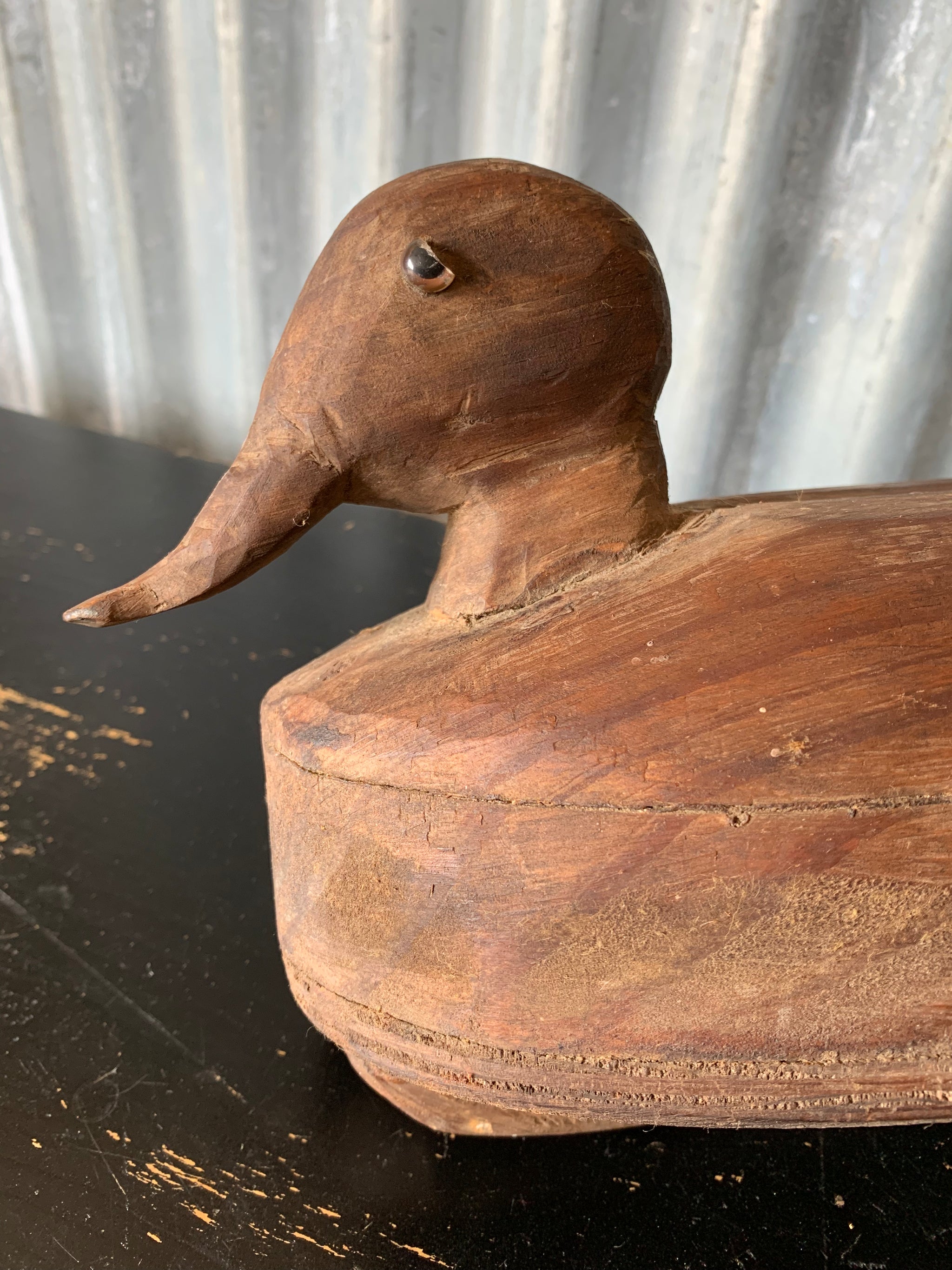 A primitive wooden duck decoy