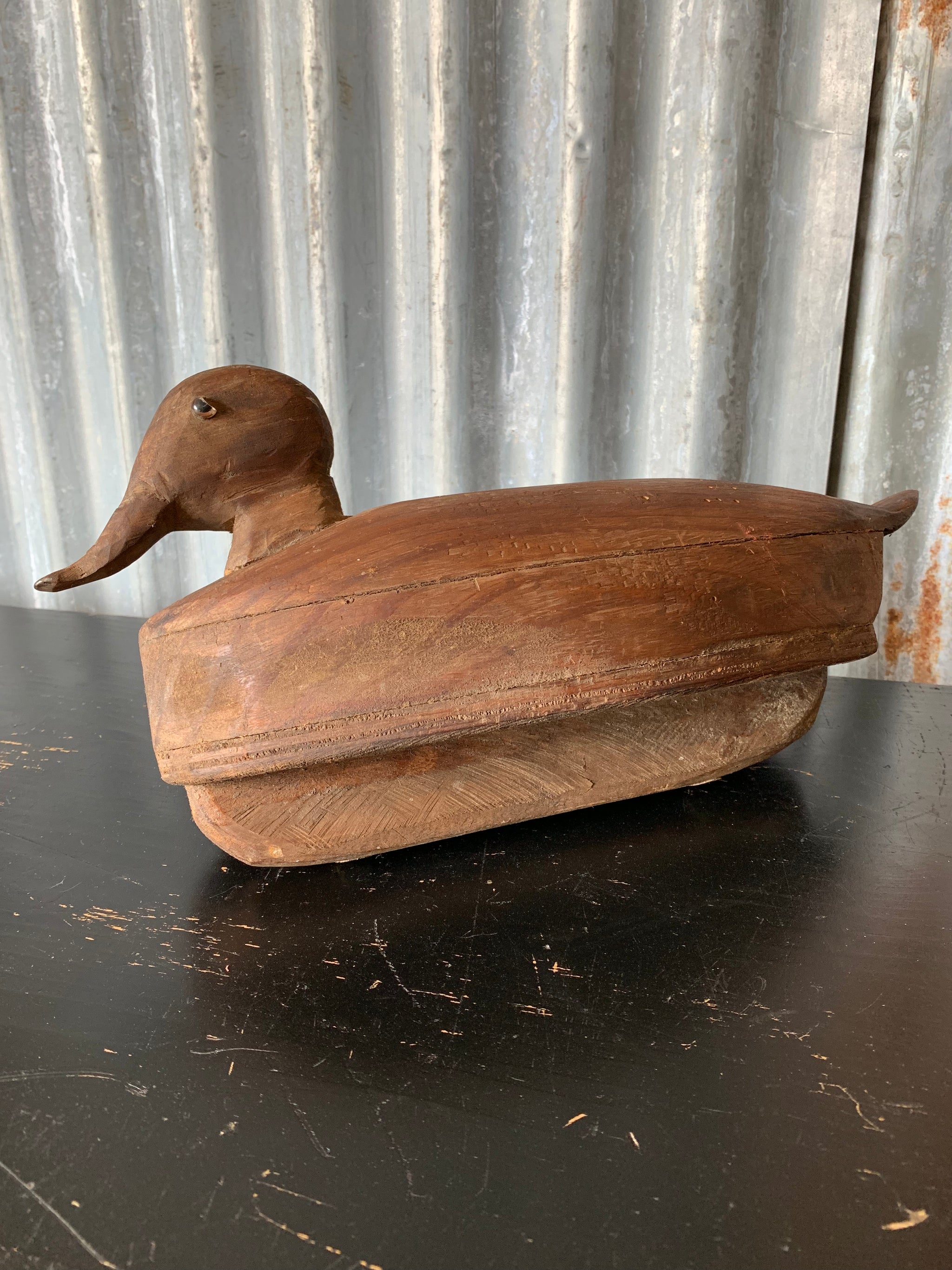 A primitive wooden duck decoy