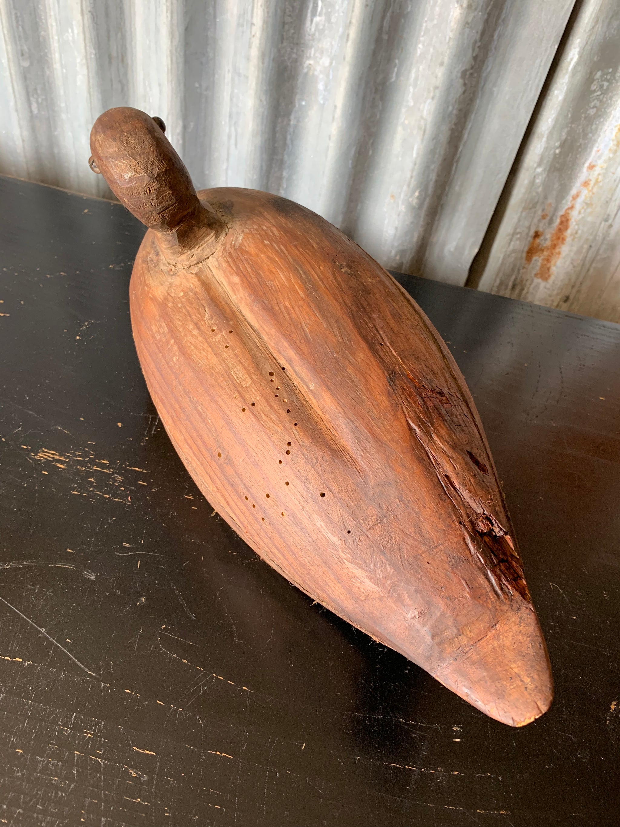A primitive wooden duck decoy