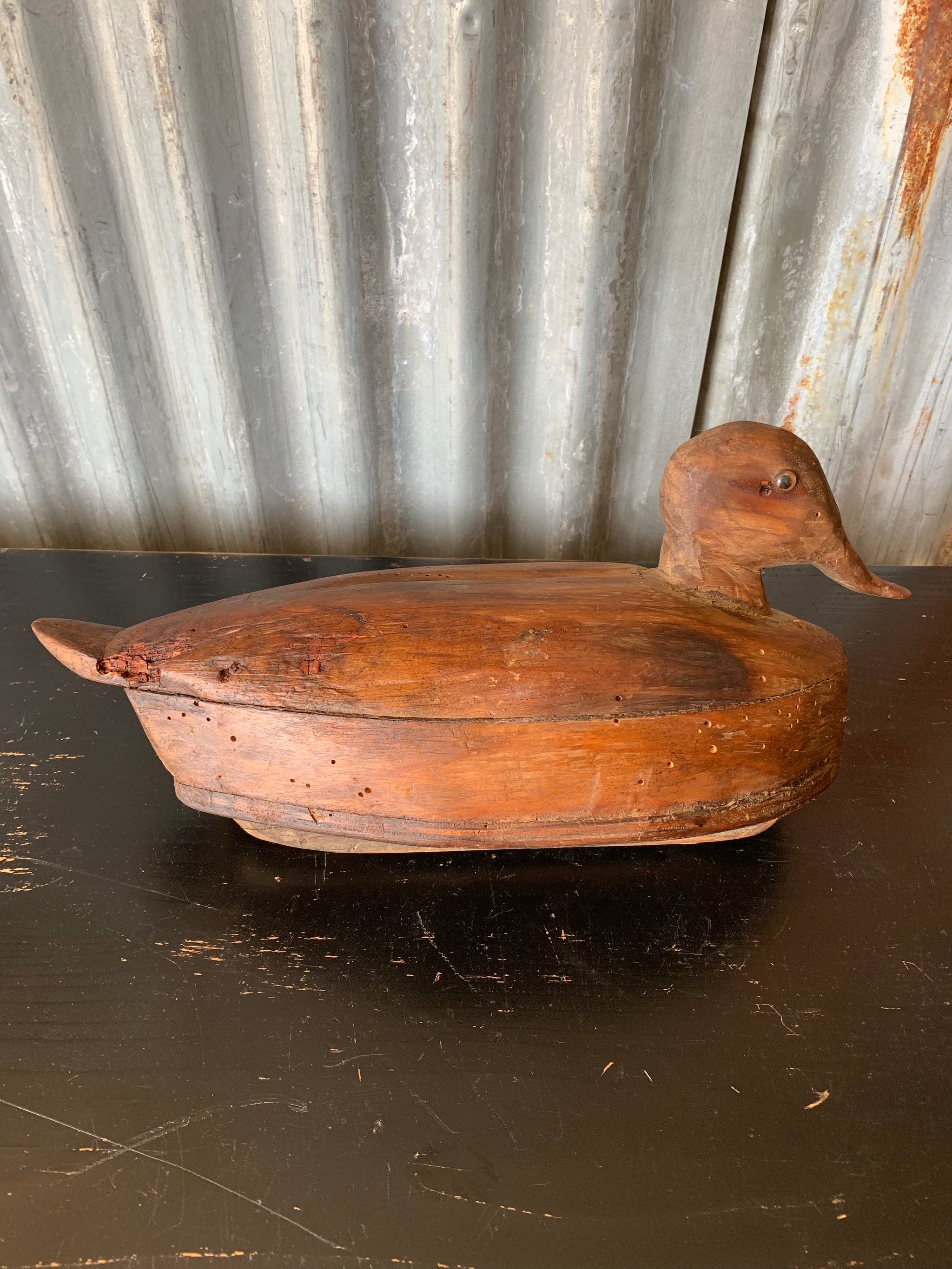 A primitive wooden duck decoy