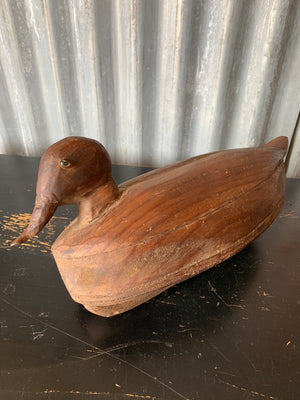 A primitive wooden duck decoy