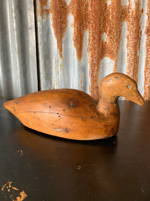 A primitive wooden duck decoy