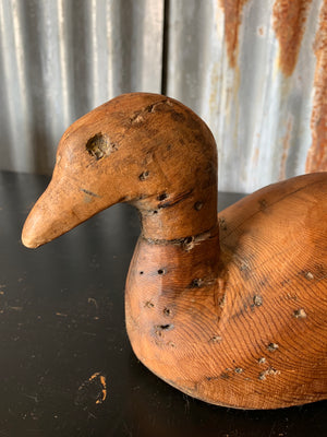 A primitive wooden duck decoy