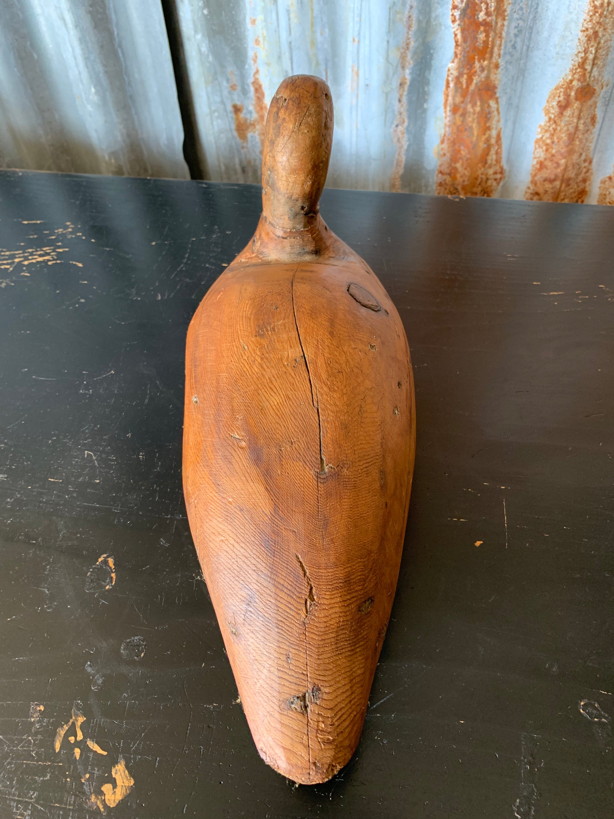 A primitive wooden duck decoy