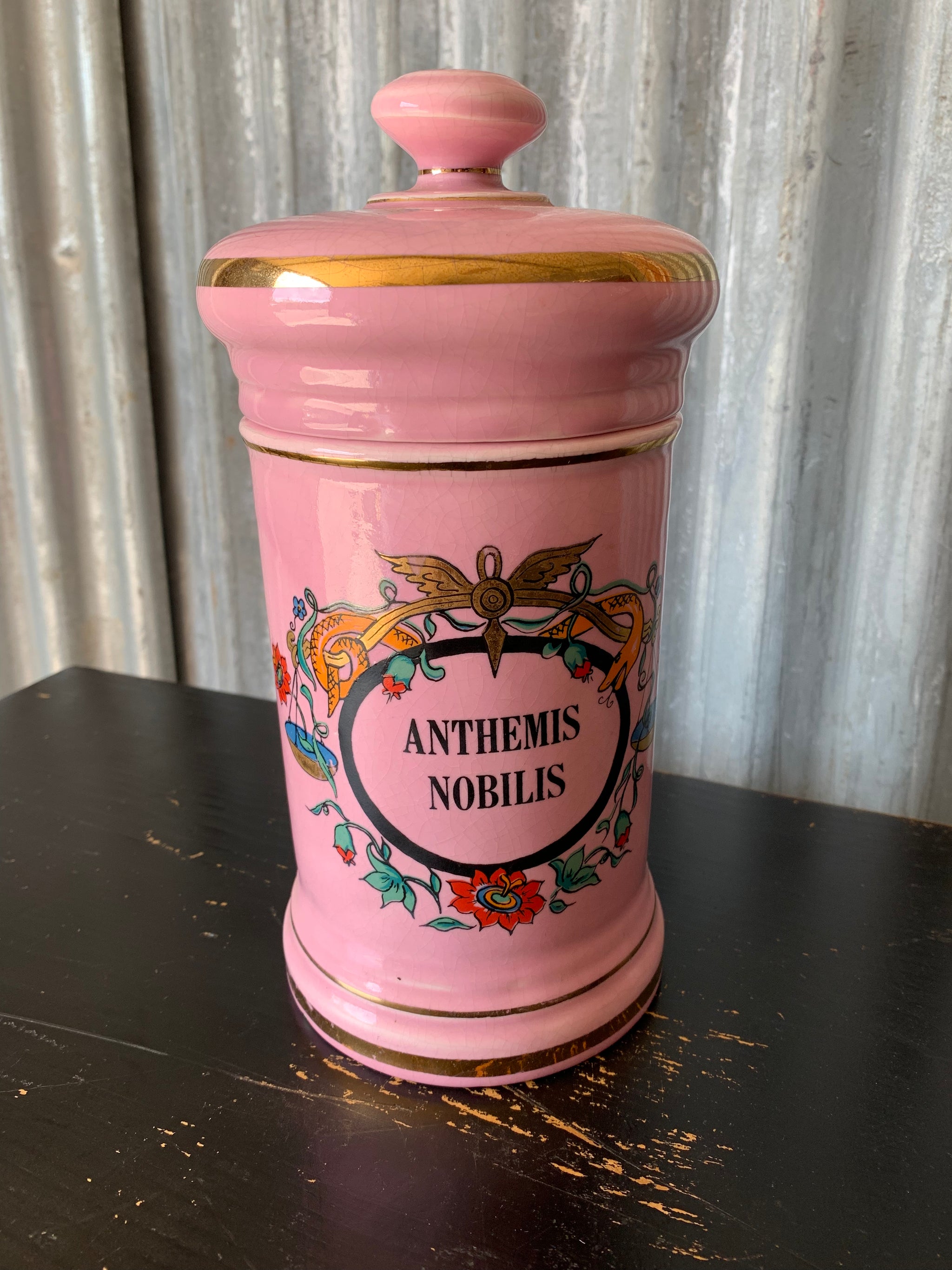 A large pink porcelain hand painted apothecary jar