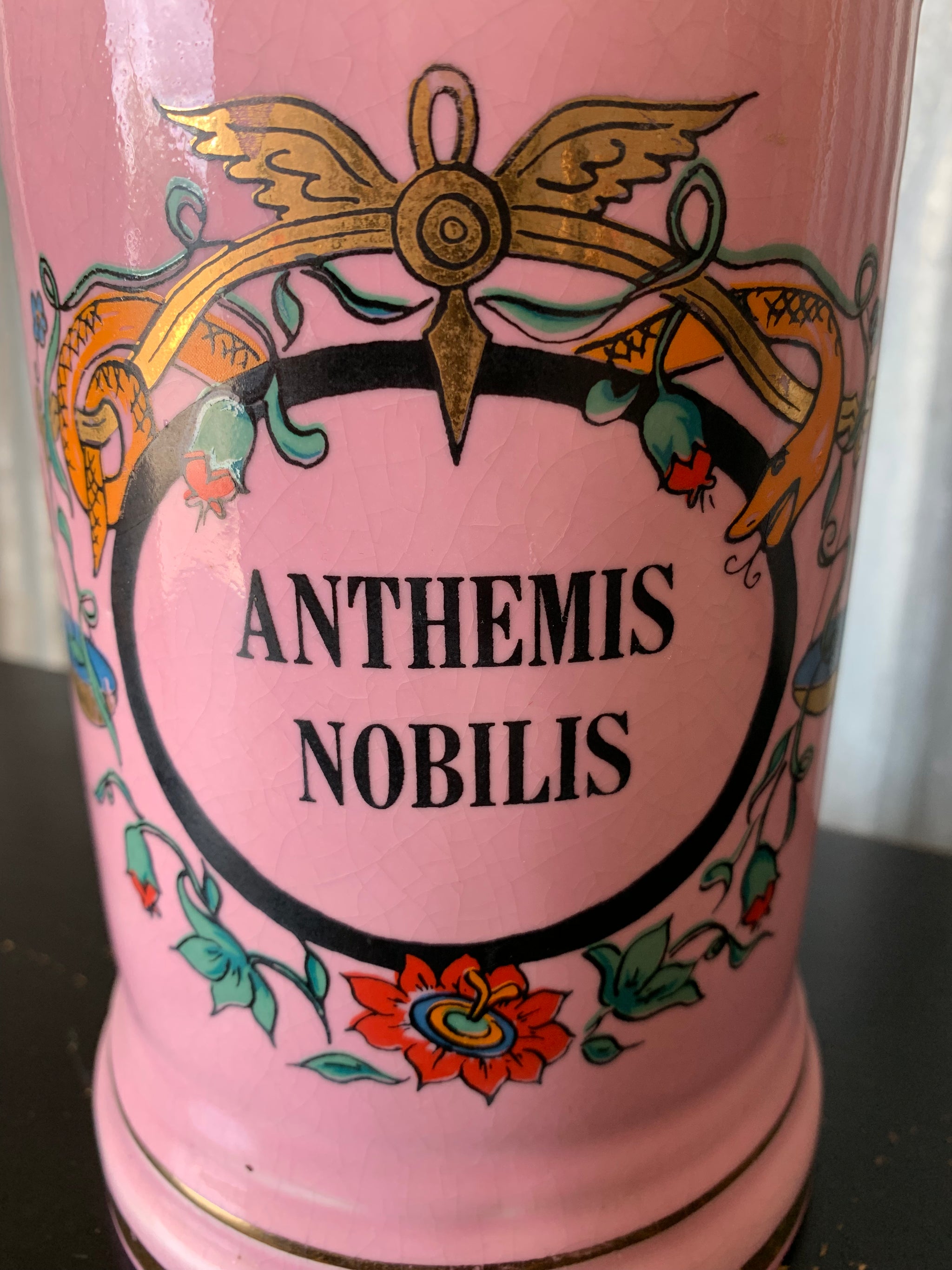 A large pink porcelain hand painted apothecary jar