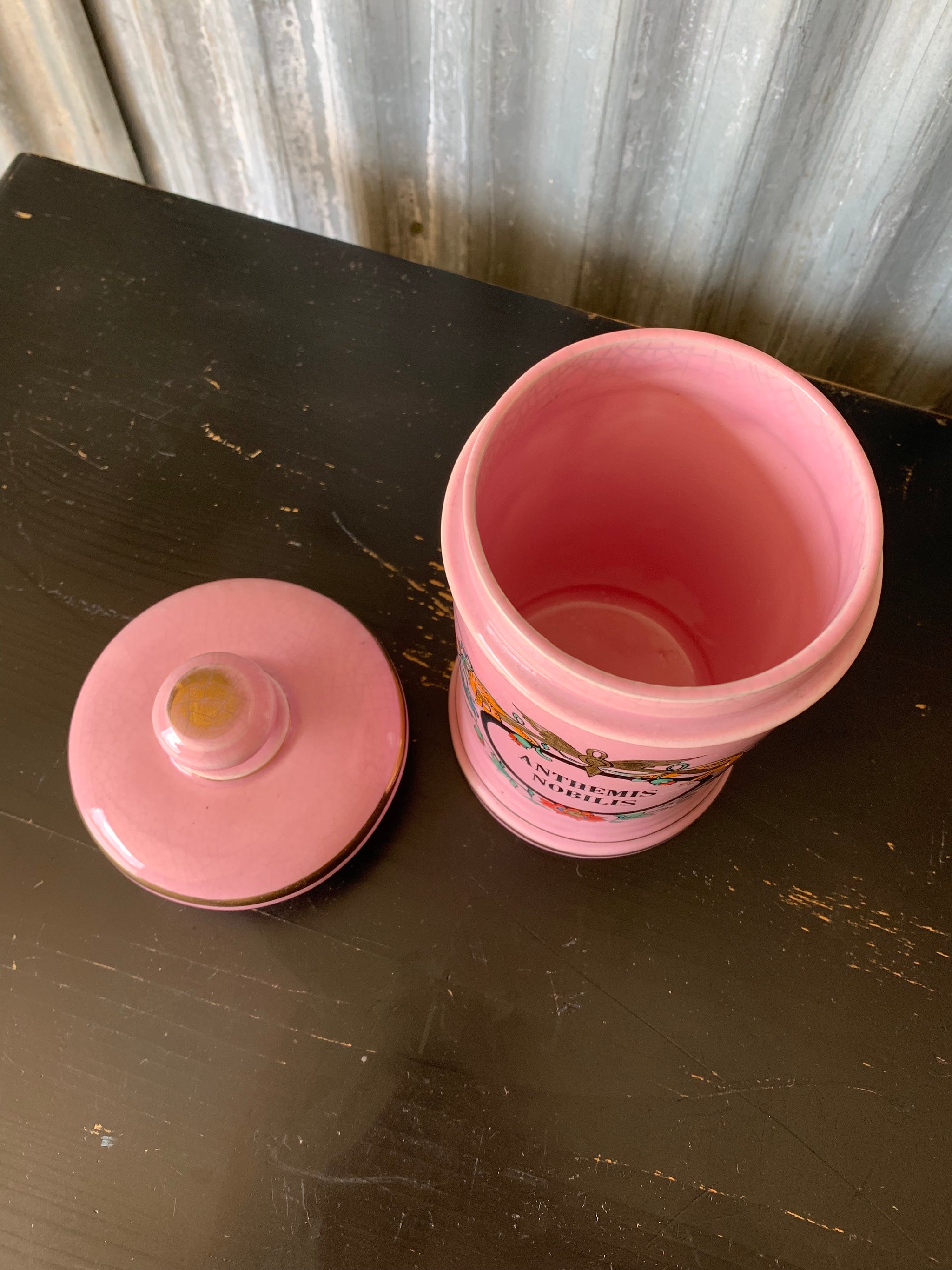 A large pink porcelain hand painted apothecary jar