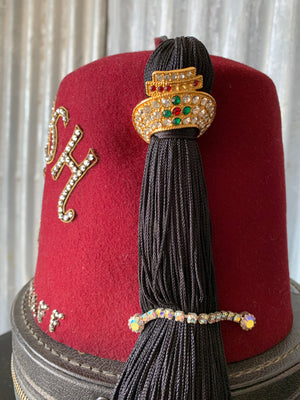 An original Shriner's fez and hat box