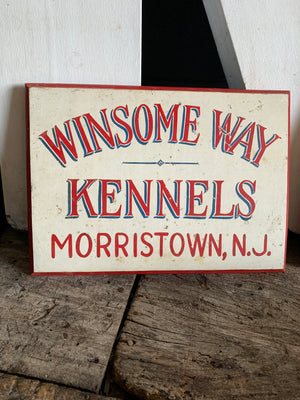 A hand painted American dog kennels sign