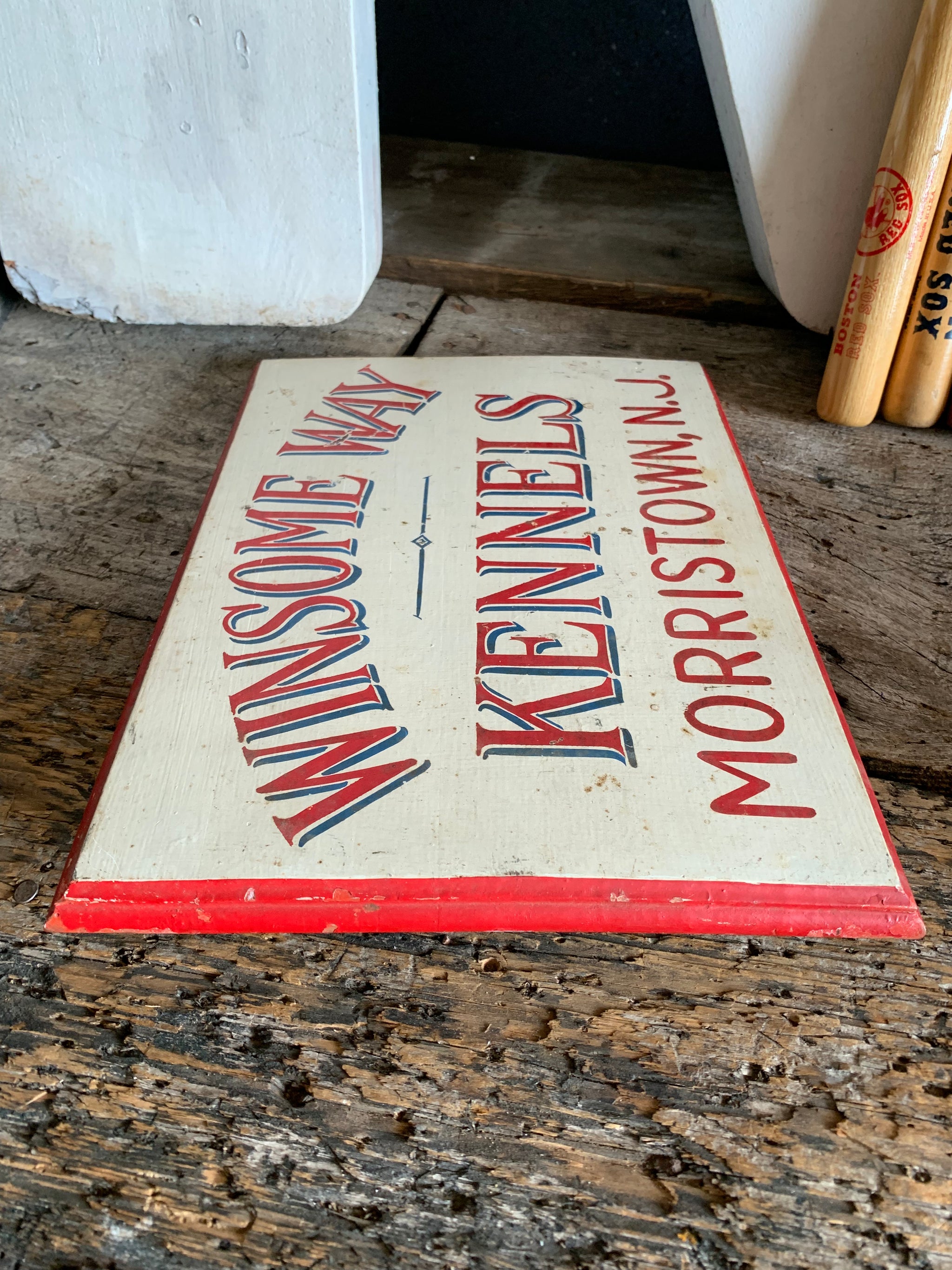A hand painted American dog kennels sign