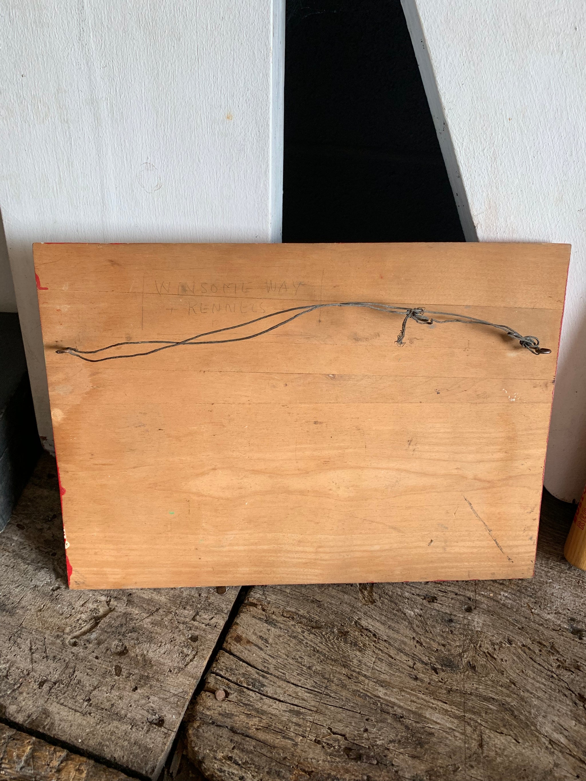 A hand painted American dog kennels sign