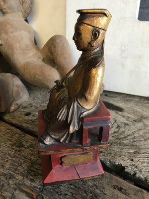 A 19th Century Chinese carved wood and gesso seated figure