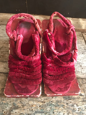 A pair of red velvet wood and gesso geisha block sandals