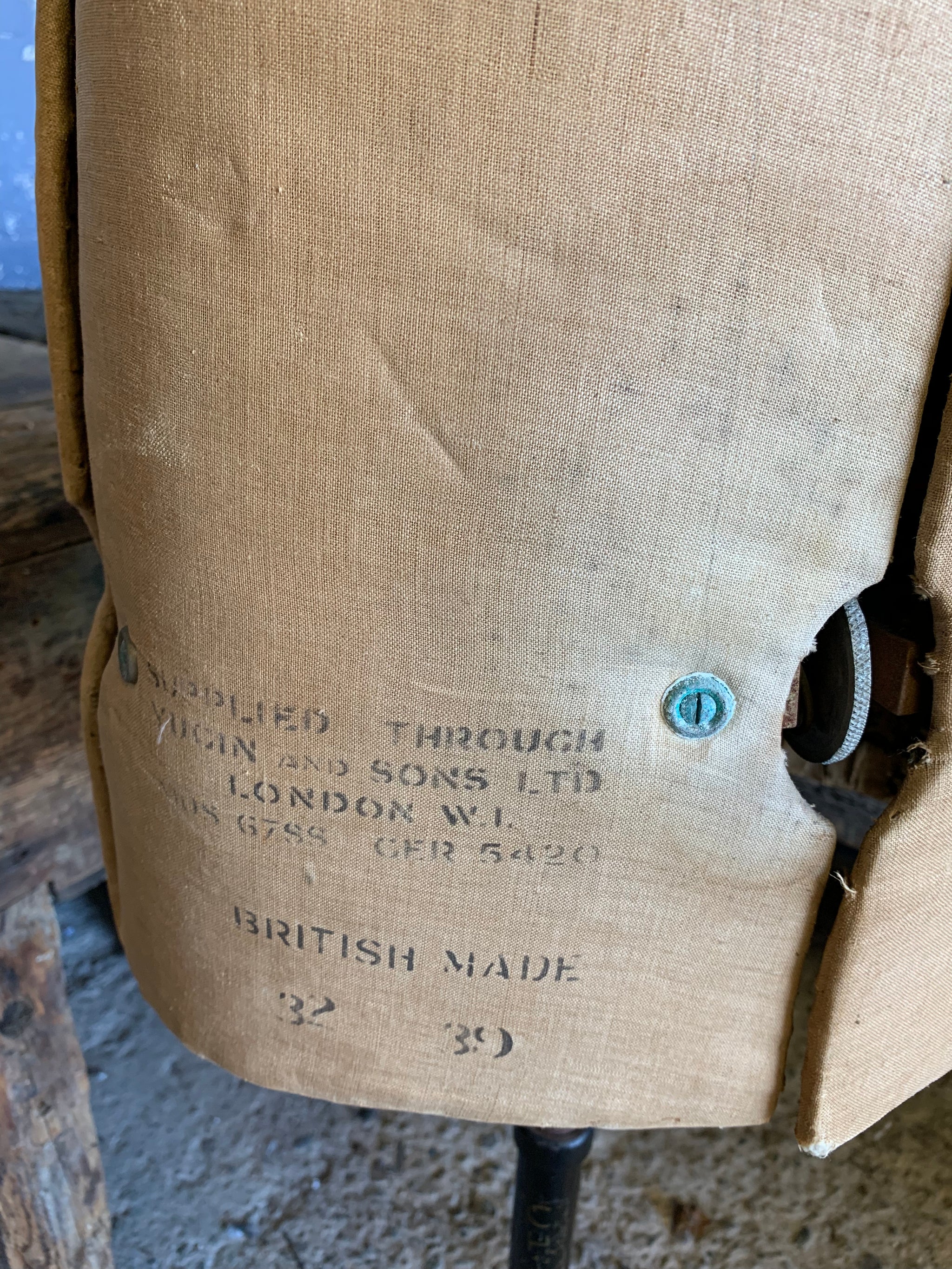 A Chil-Daw female mannequin dress form with cast iron base