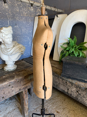 A Chil-Daw female mannequin dress form with cast iron base
