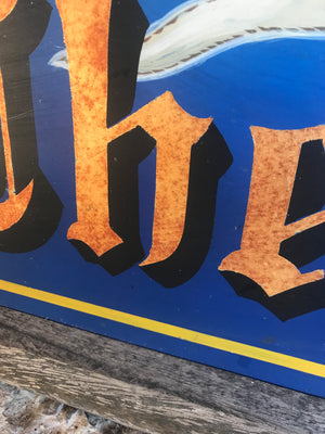 A wooden double-sided hand-painted pub sign