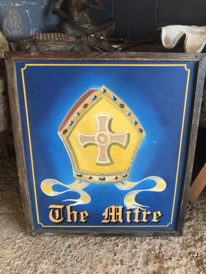 A wooden double-sided hand-painted pub sign