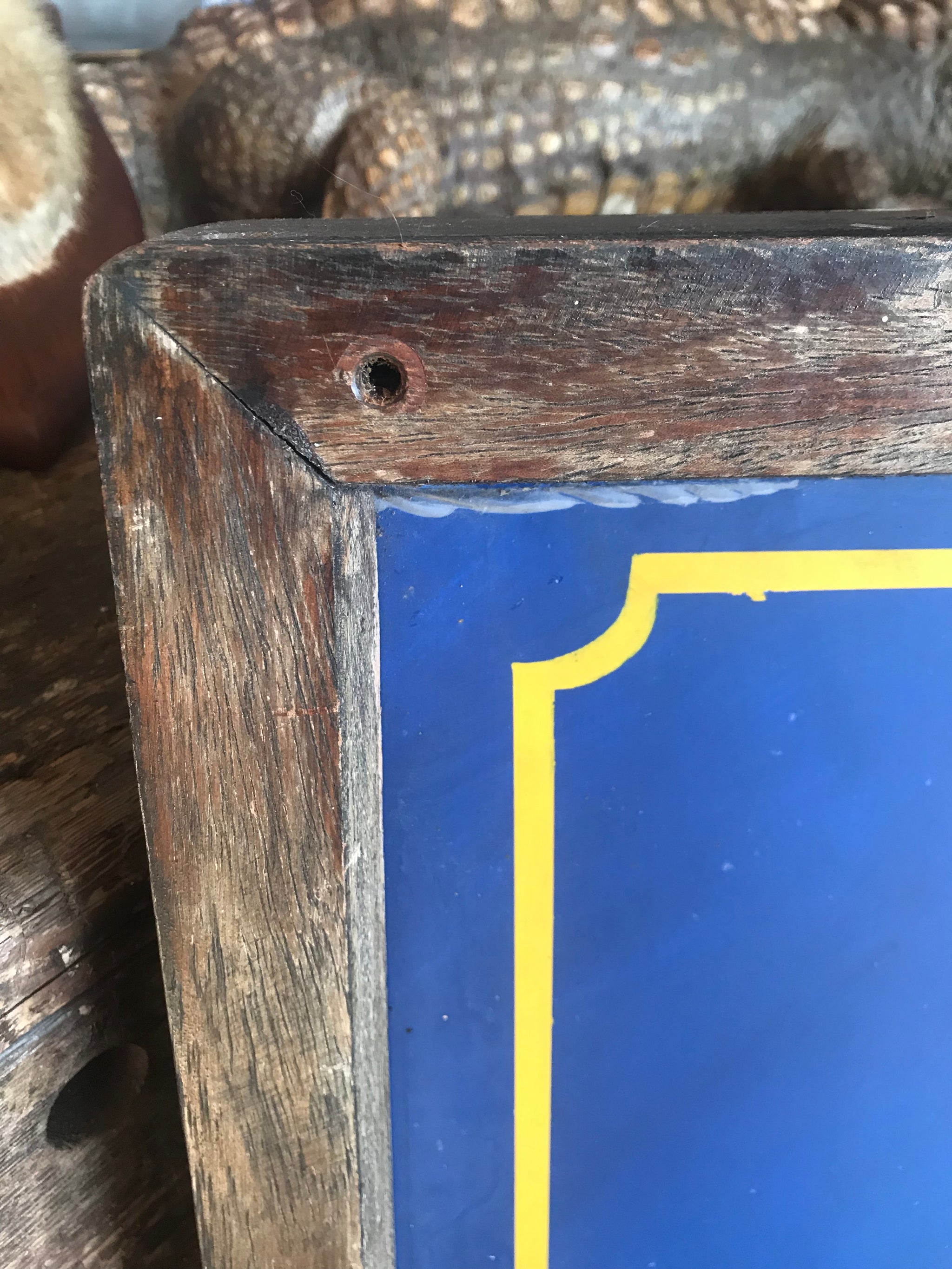 A wooden double-sided hand-painted pub sign