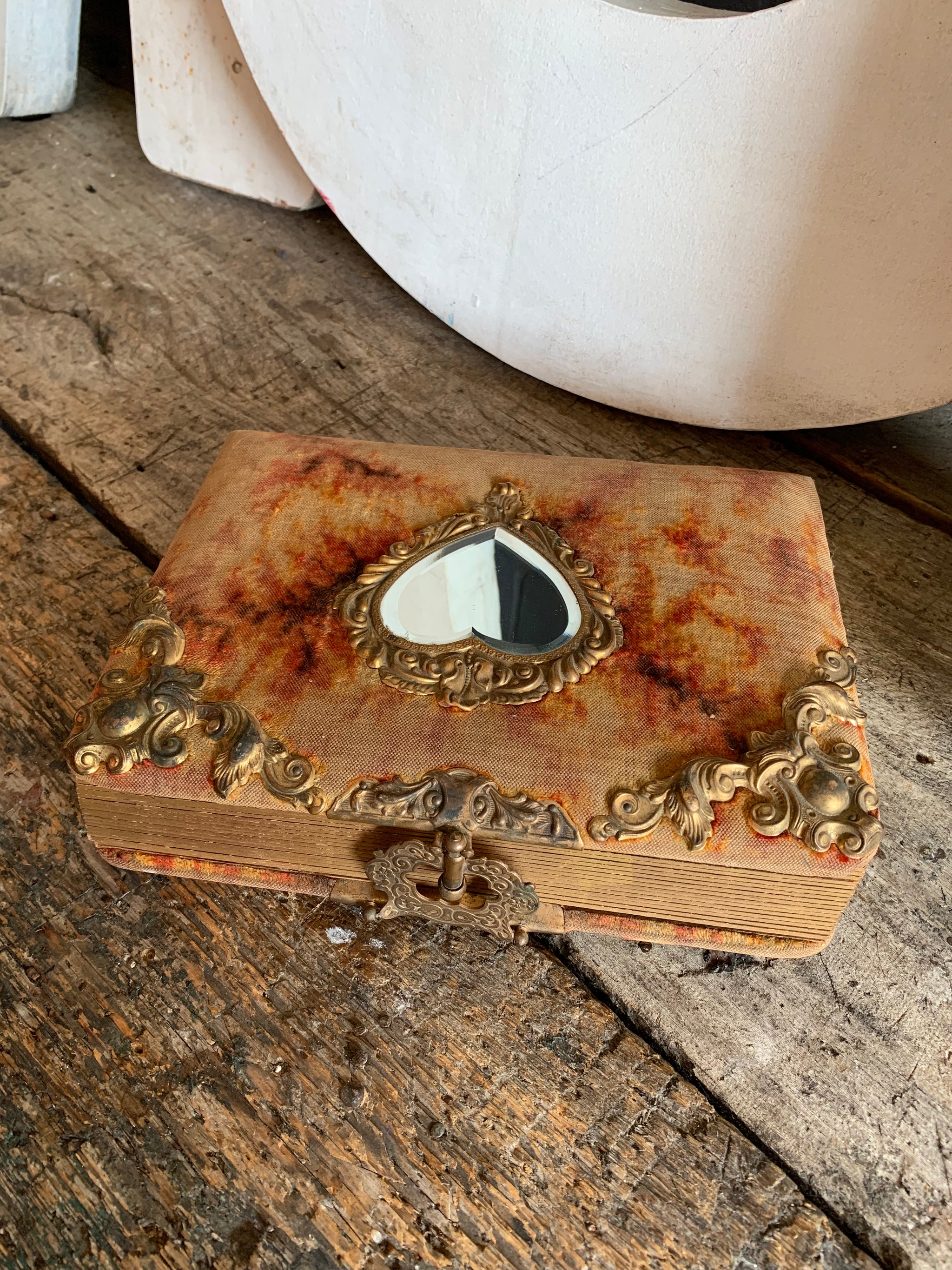 A Victorian cartes de visite photo album with velvet cover and heart-shaped mirror insert