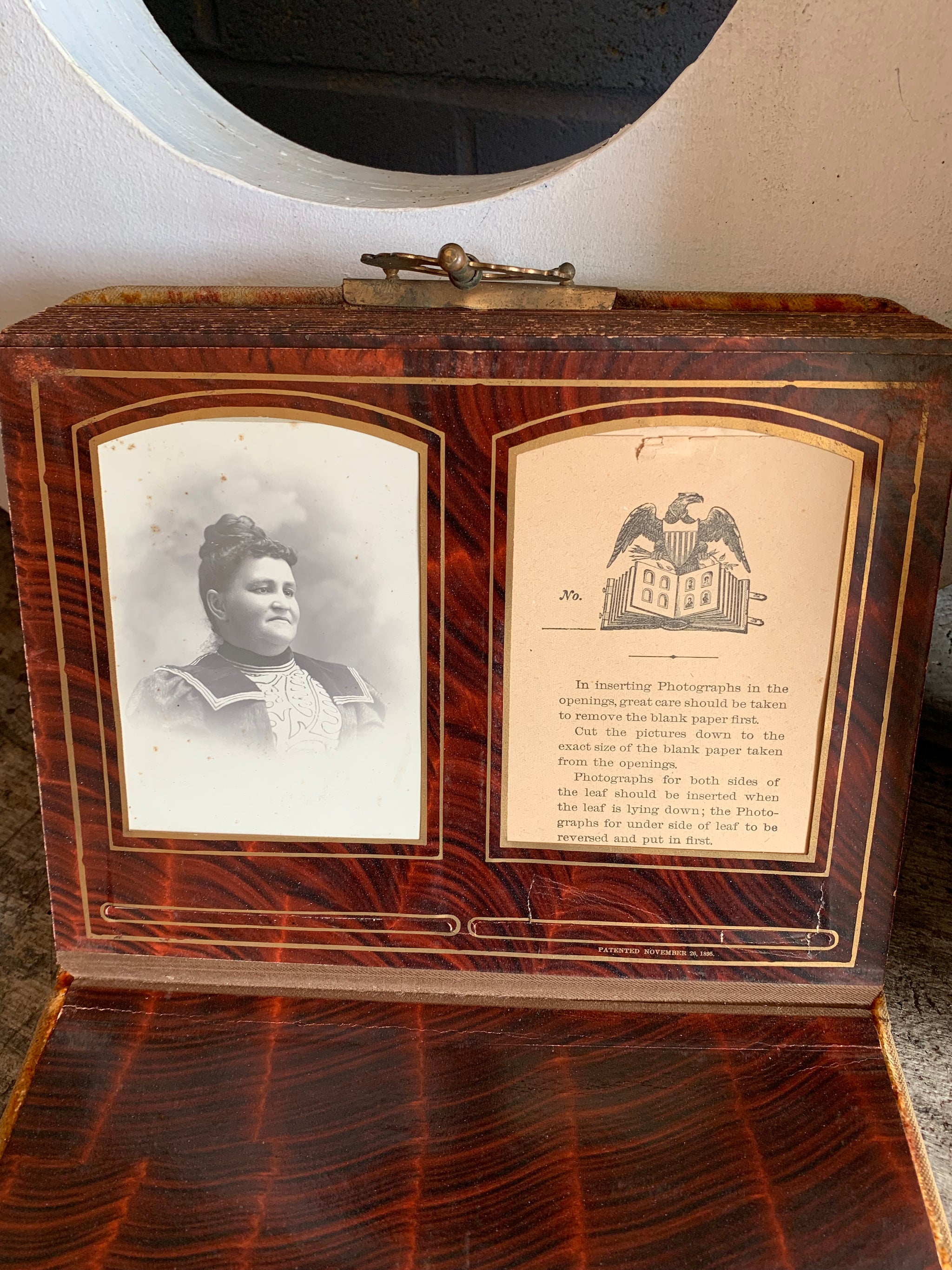A Victorian cartes de visite photo album with velvet cover and heart-shaped mirror insert