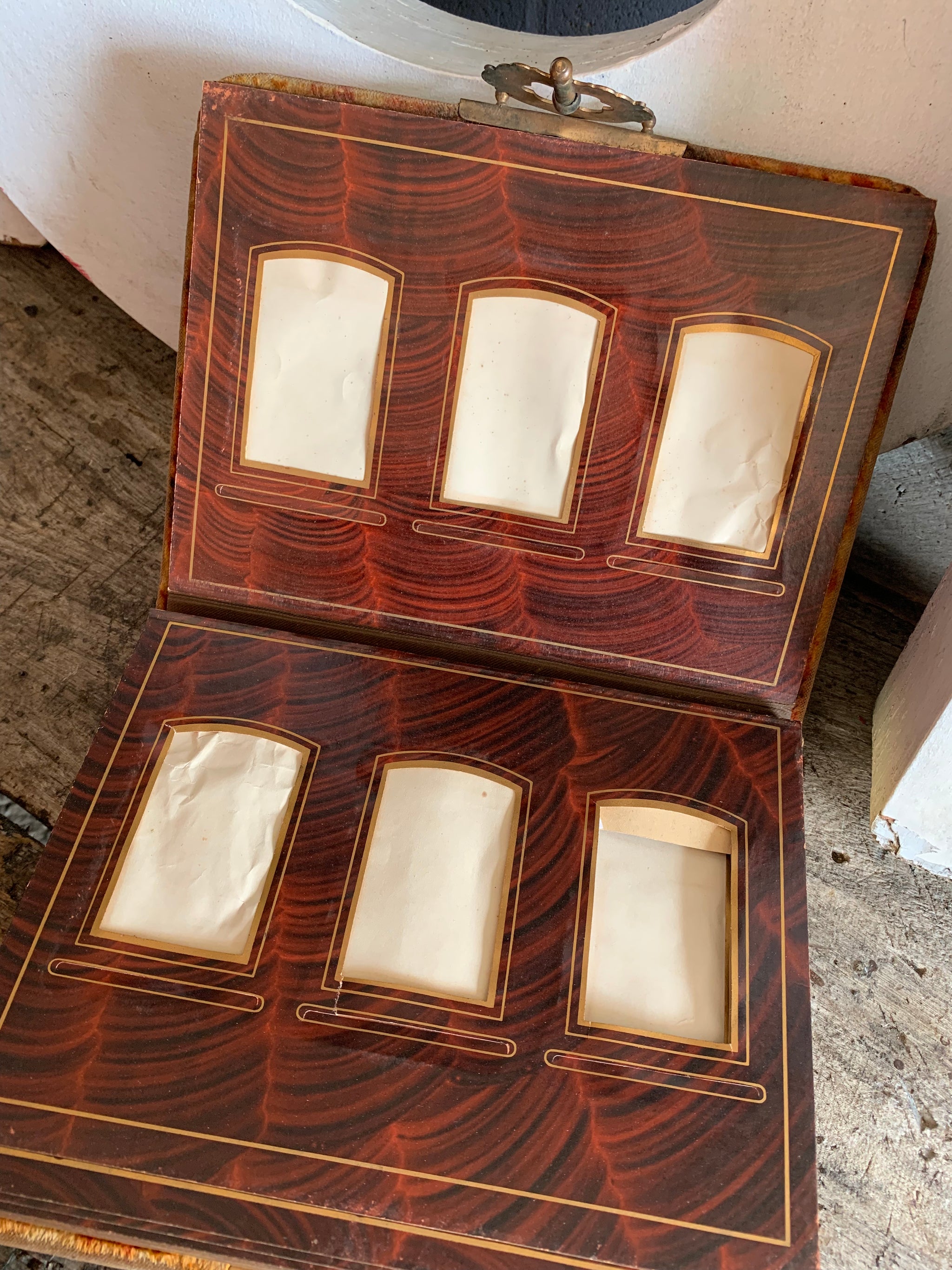 A Victorian cartes de visite photo album with velvet cover and heart-shaped mirror insert
