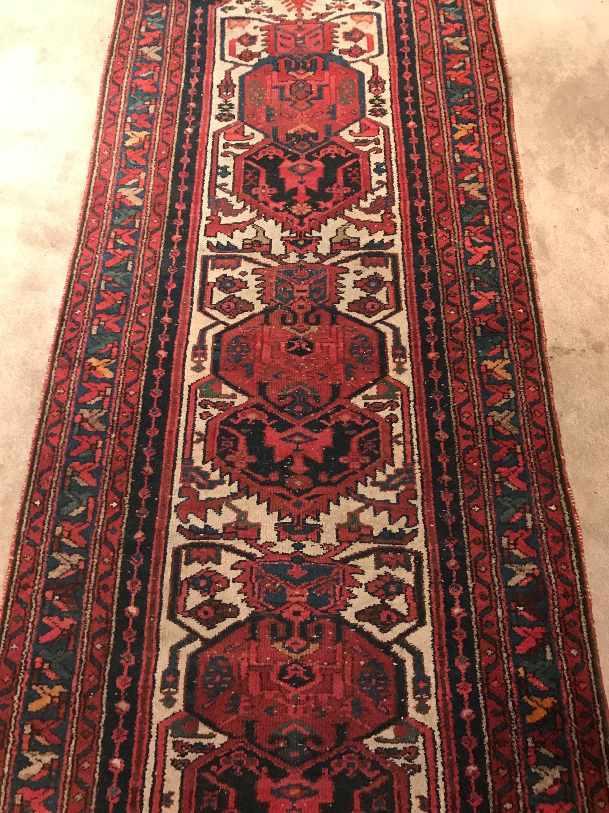 A red ground wool Persian runner rug- 295cm x 95cm