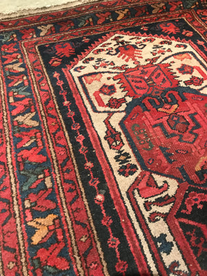 A red ground wool Persian runner rug- 295cm x 95cm