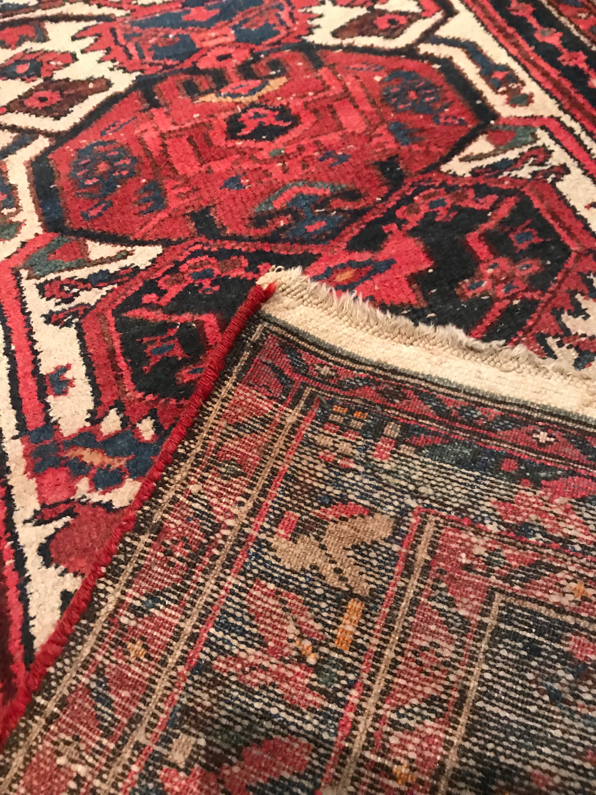 A red ground wool Persian runner rug- 295cm x 95cm