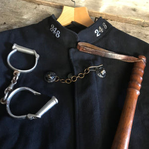 An early woolen police cape with black lion head clasp- Hertfordshire Constabulary