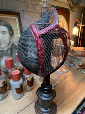 A leather and wire mesh fencing mask