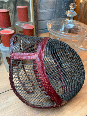 A leather and wire mesh fencing mask