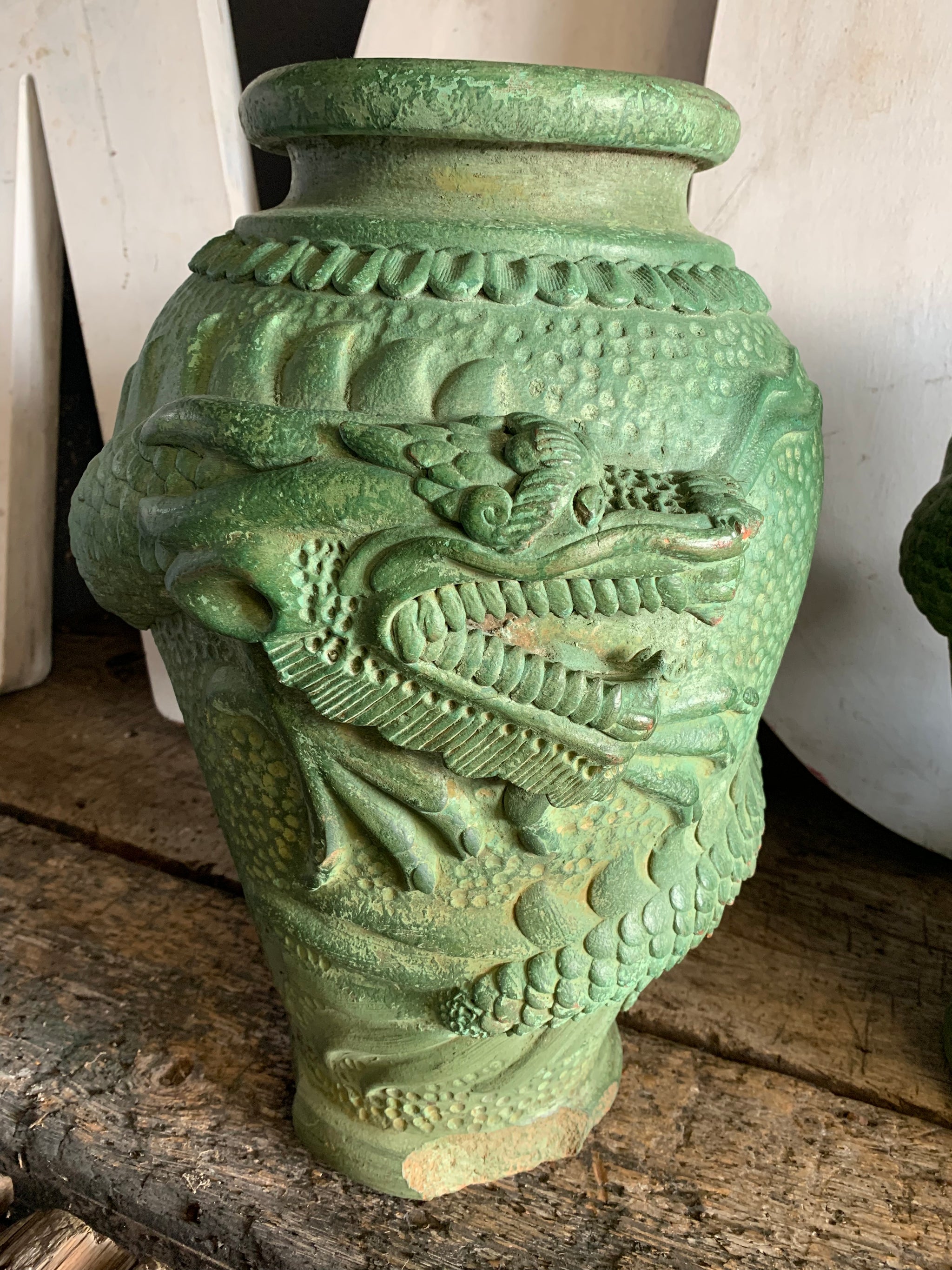 A large pair of green Yixing / Tokoname style terracotta dragon motif urns