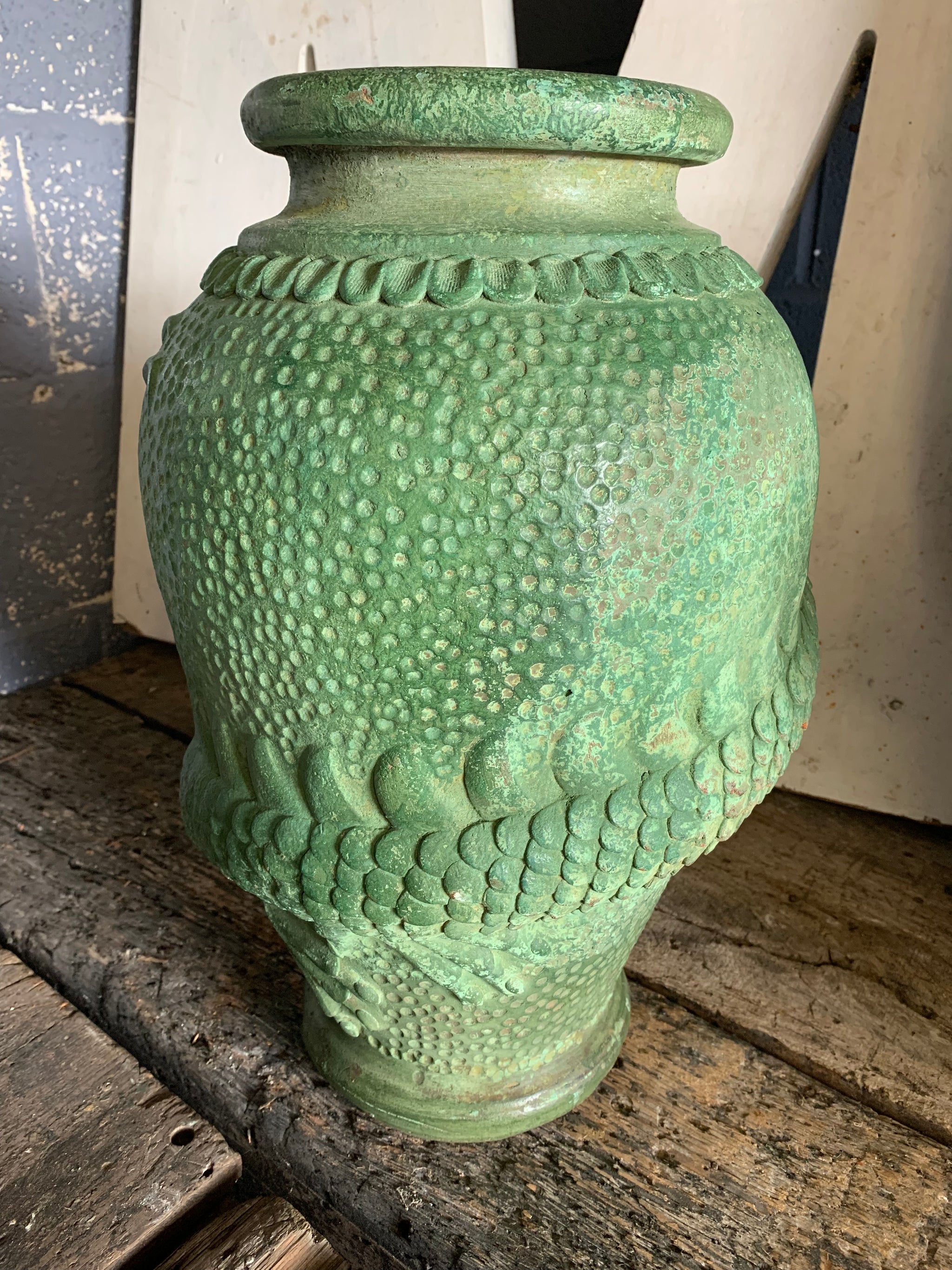 A large pair of green Yixing / Tokoname style terracotta dragon motif urns
