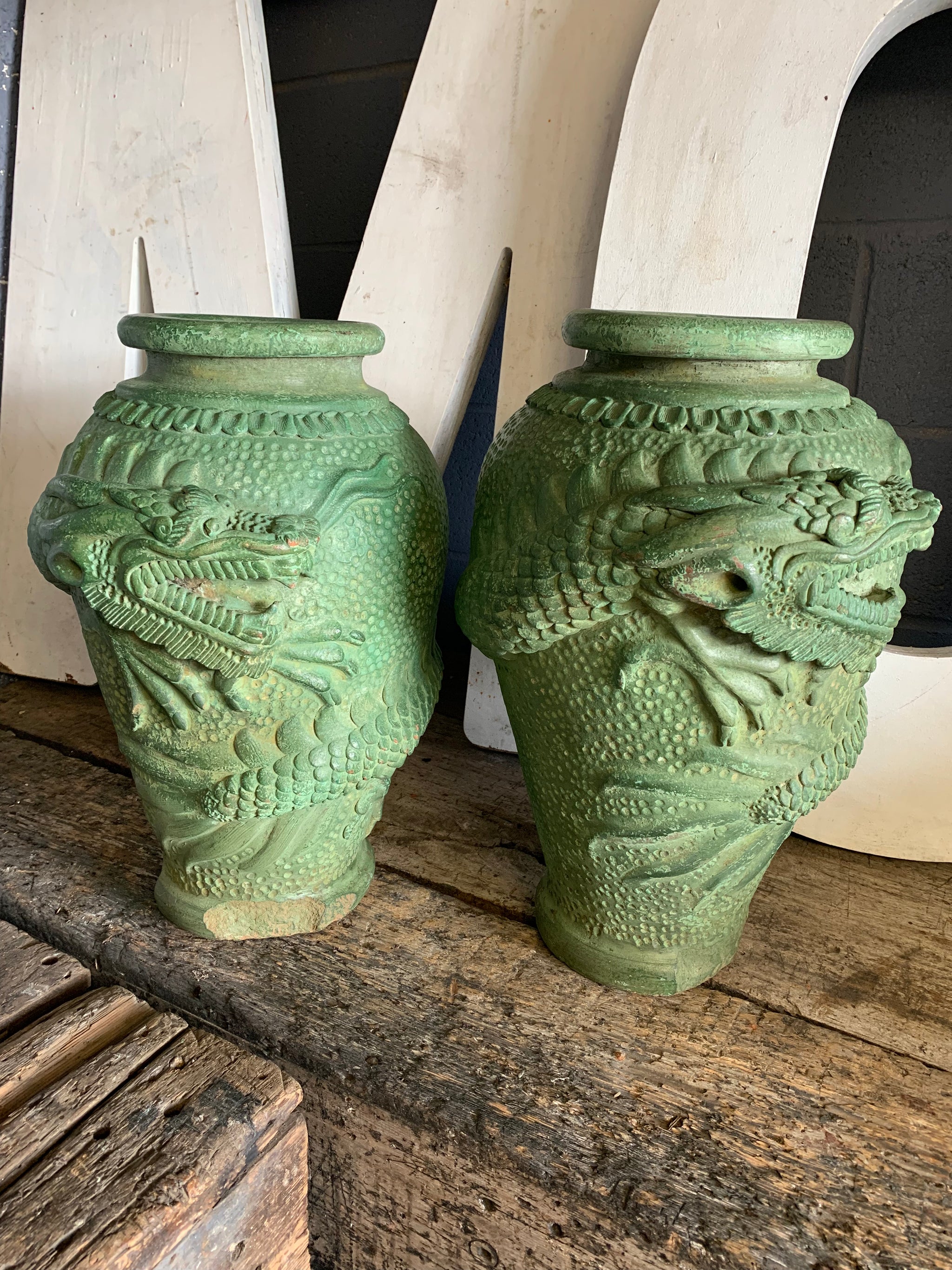 A large pair of green Yixing / Tokoname style terracotta dragon motif urns