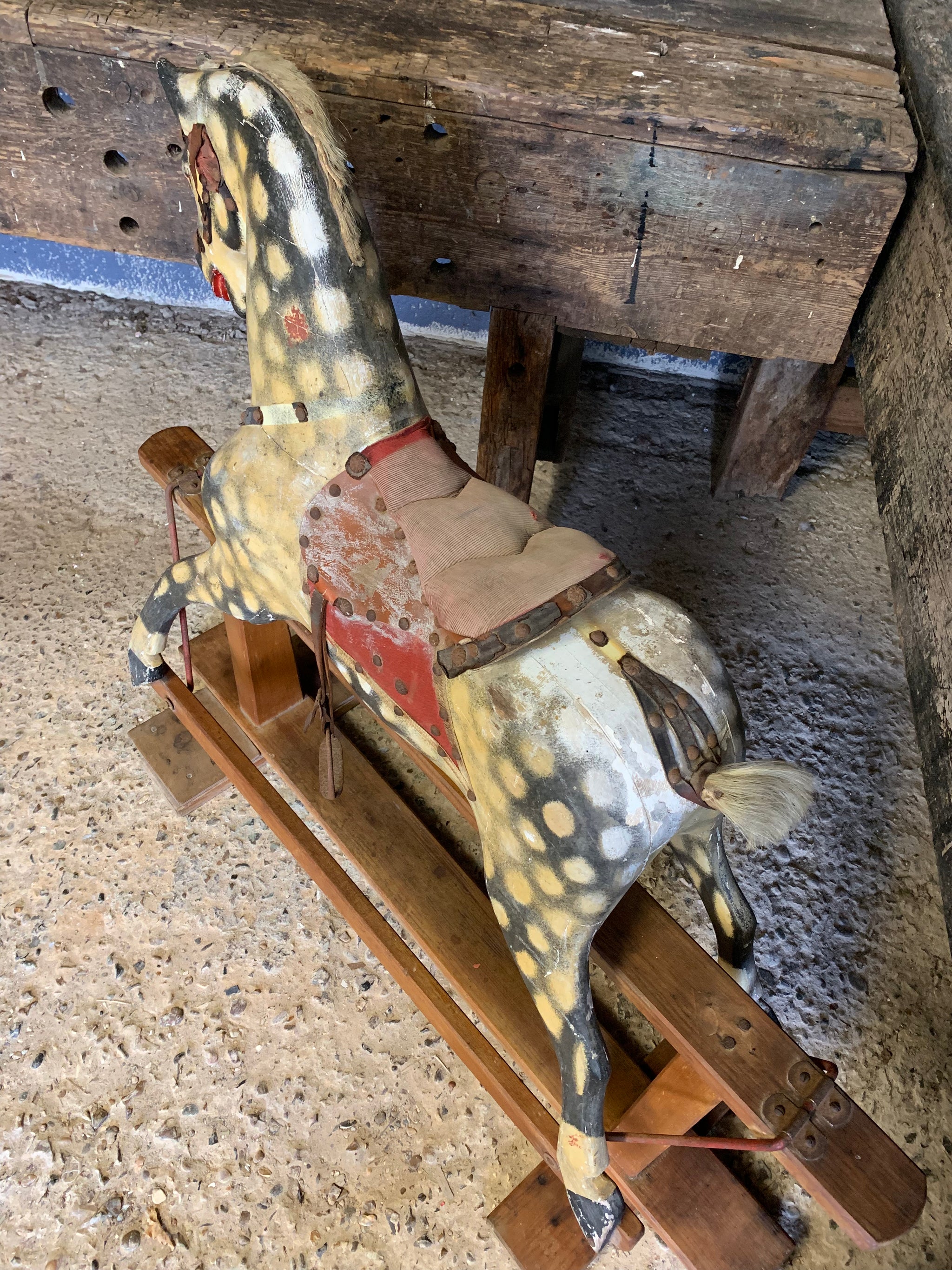 An Edwardian Collinson rocking horse in original condition
