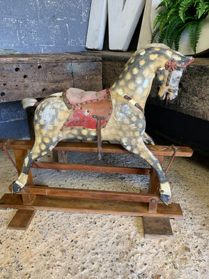 An Edwardian Collinson rocking horse in original condition