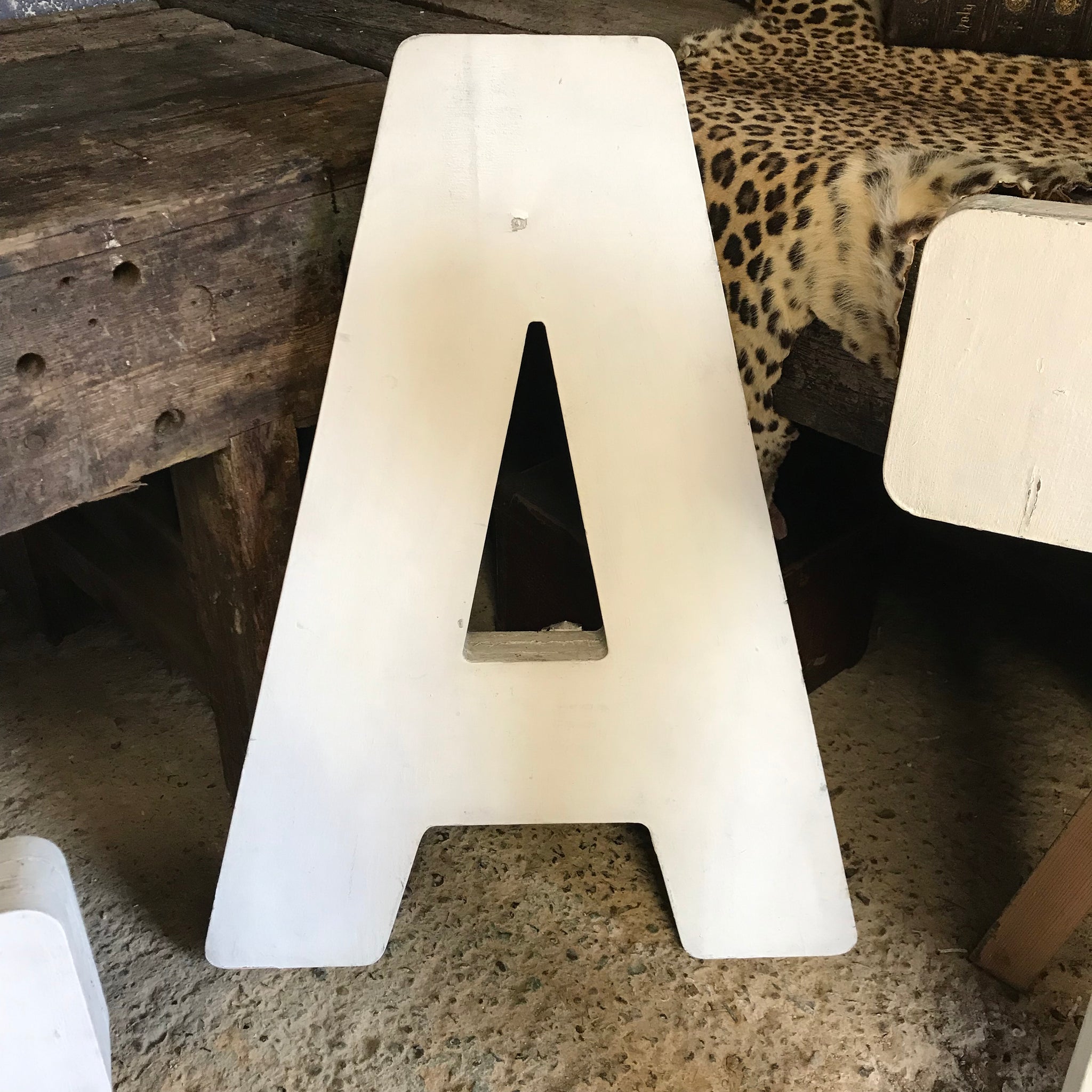 A trio of extra large wooden trade sign letters