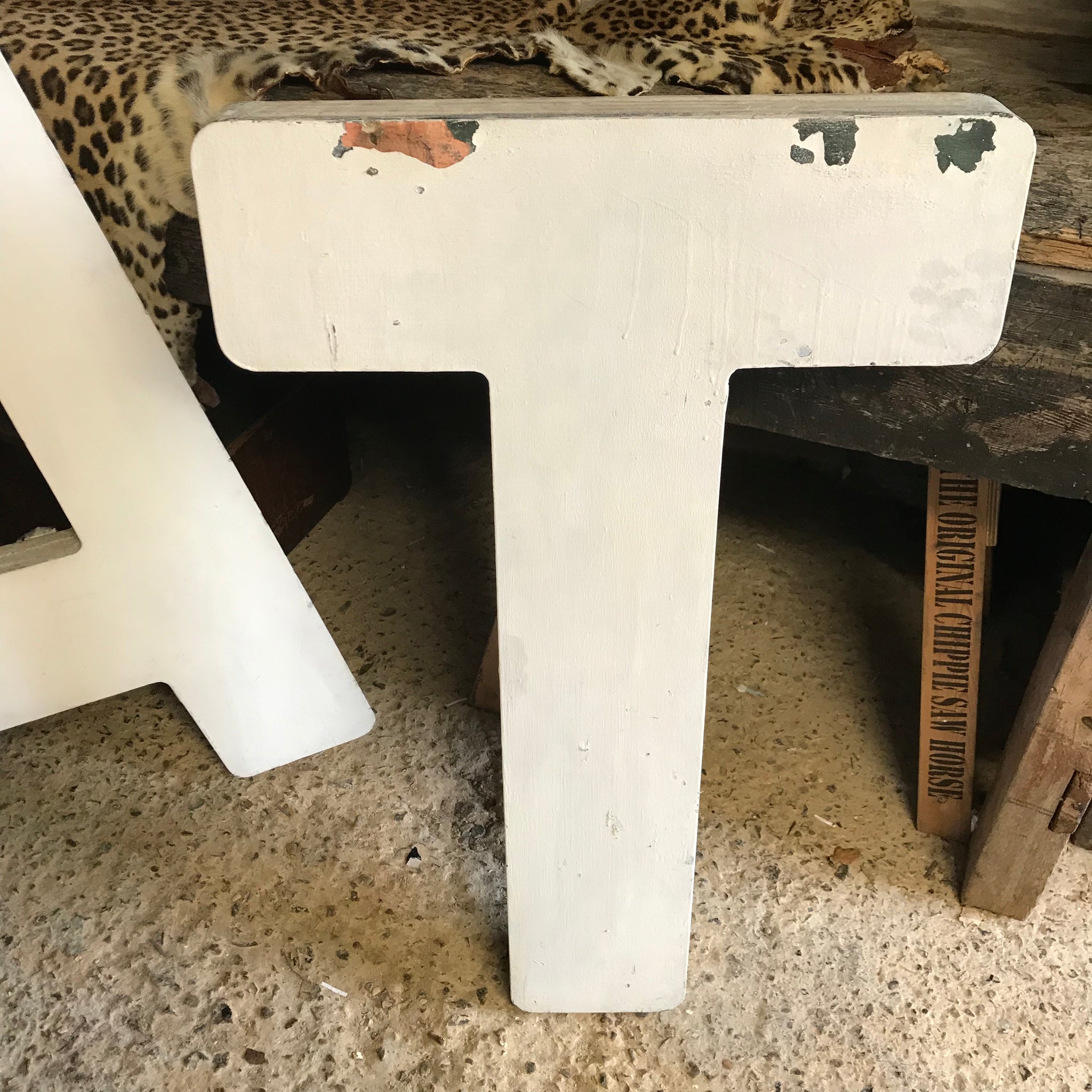 A trio of extra large wooden trade sign letters