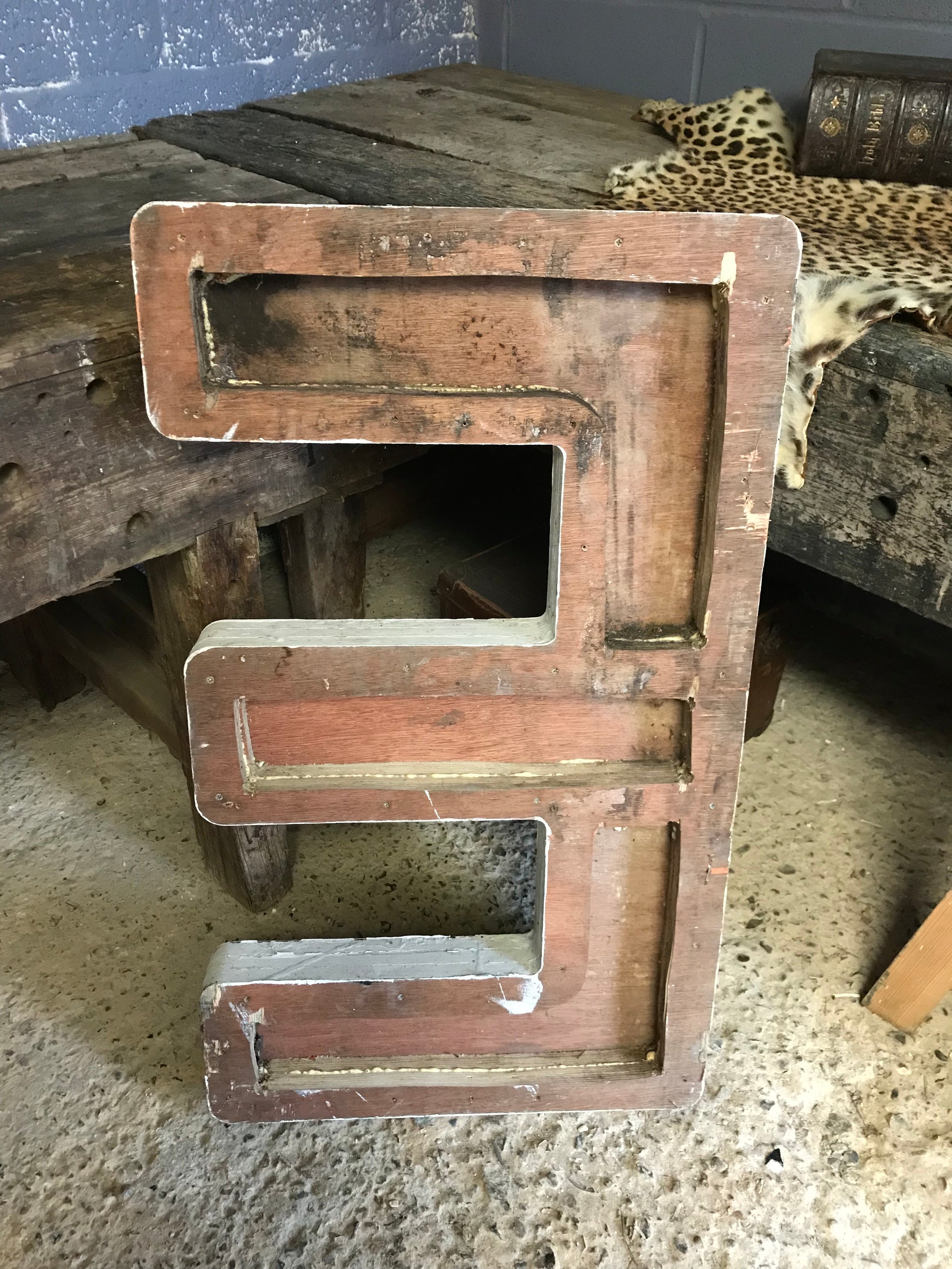 A trio of extra large wooden trade sign letters