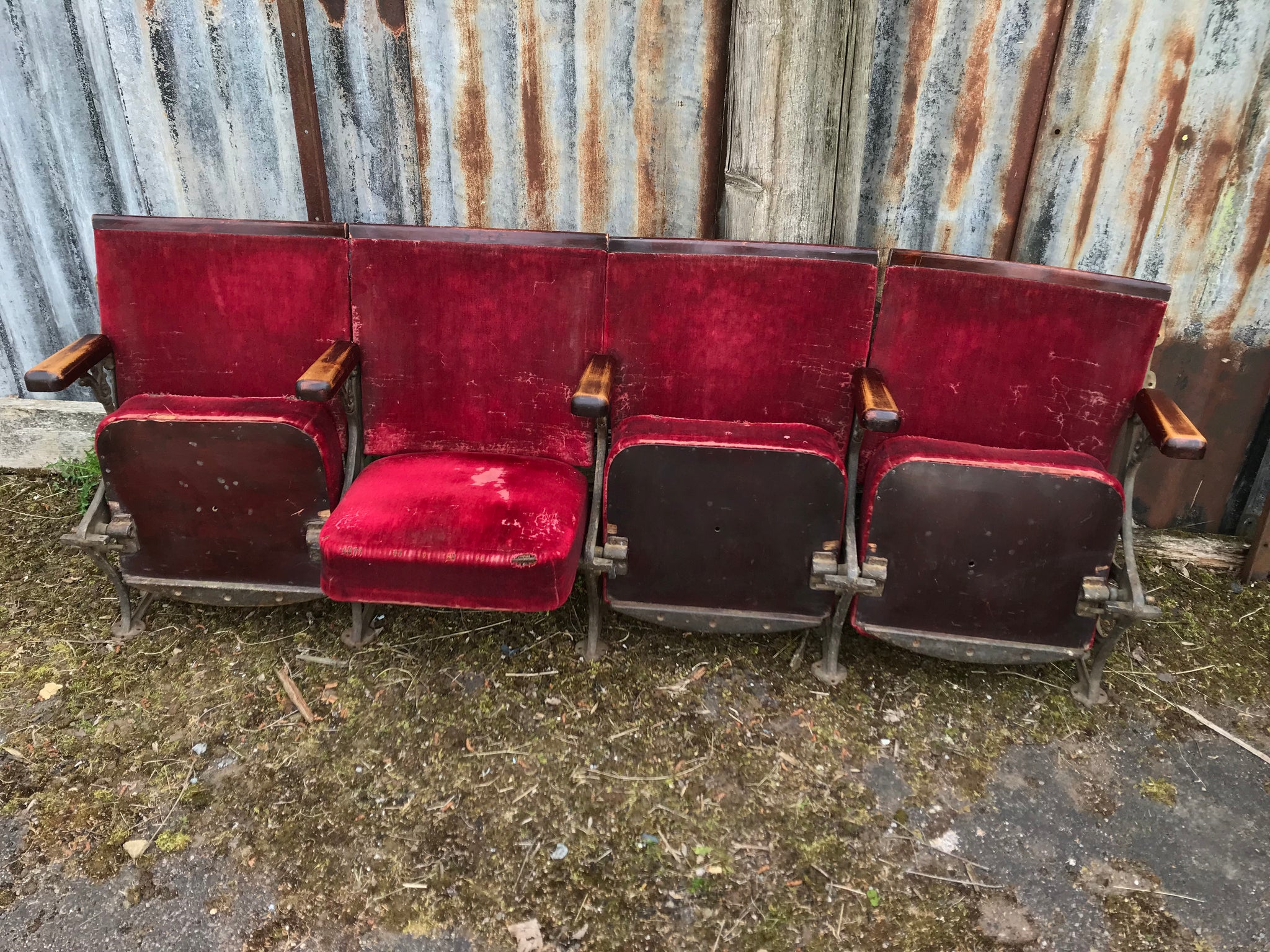 A row of red velvet flip cinema or theatre seats