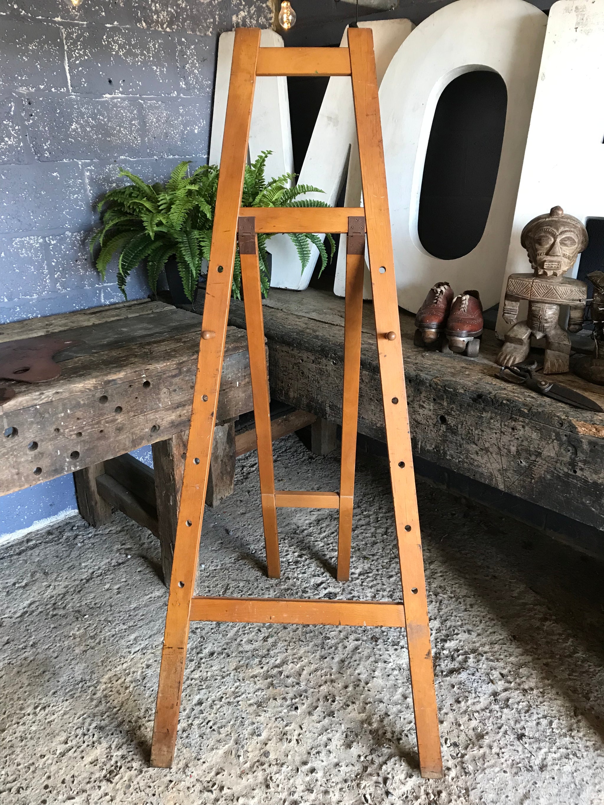 A flat full size floor standing studio peg easel