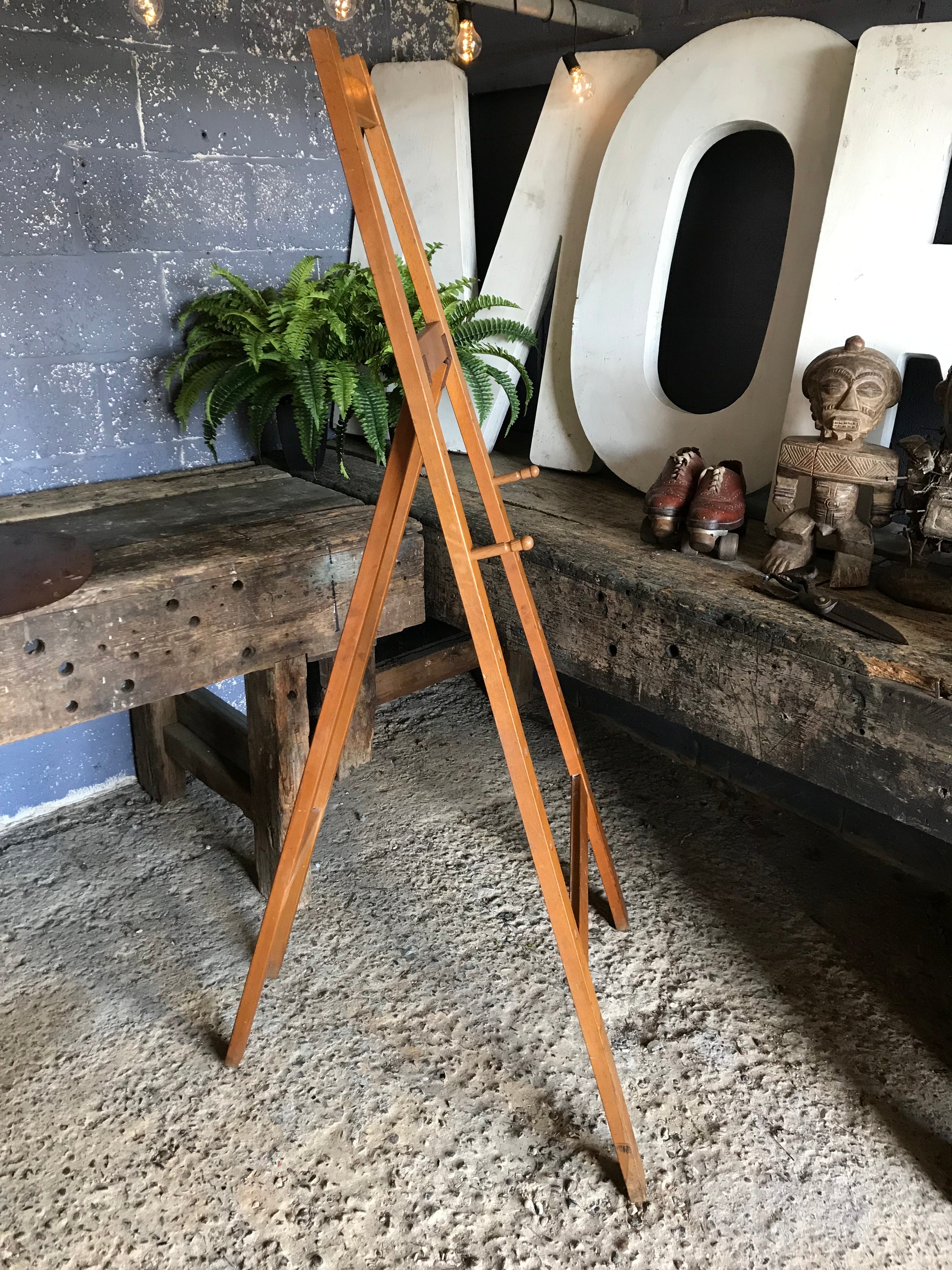 A flat full size floor standing studio peg easel