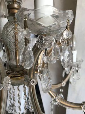 A large cut glass twelve light chandelier