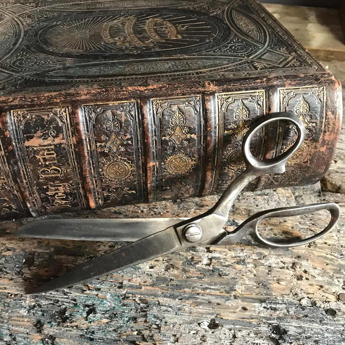 A pair of large metal tailor's scissors shears