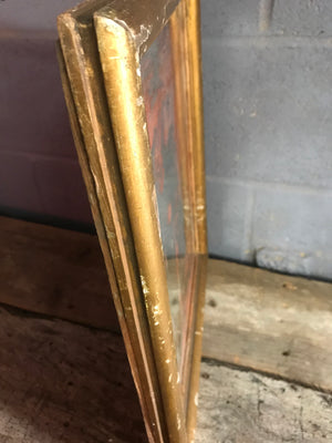 A heavily distressed gilt mercury wall mirror