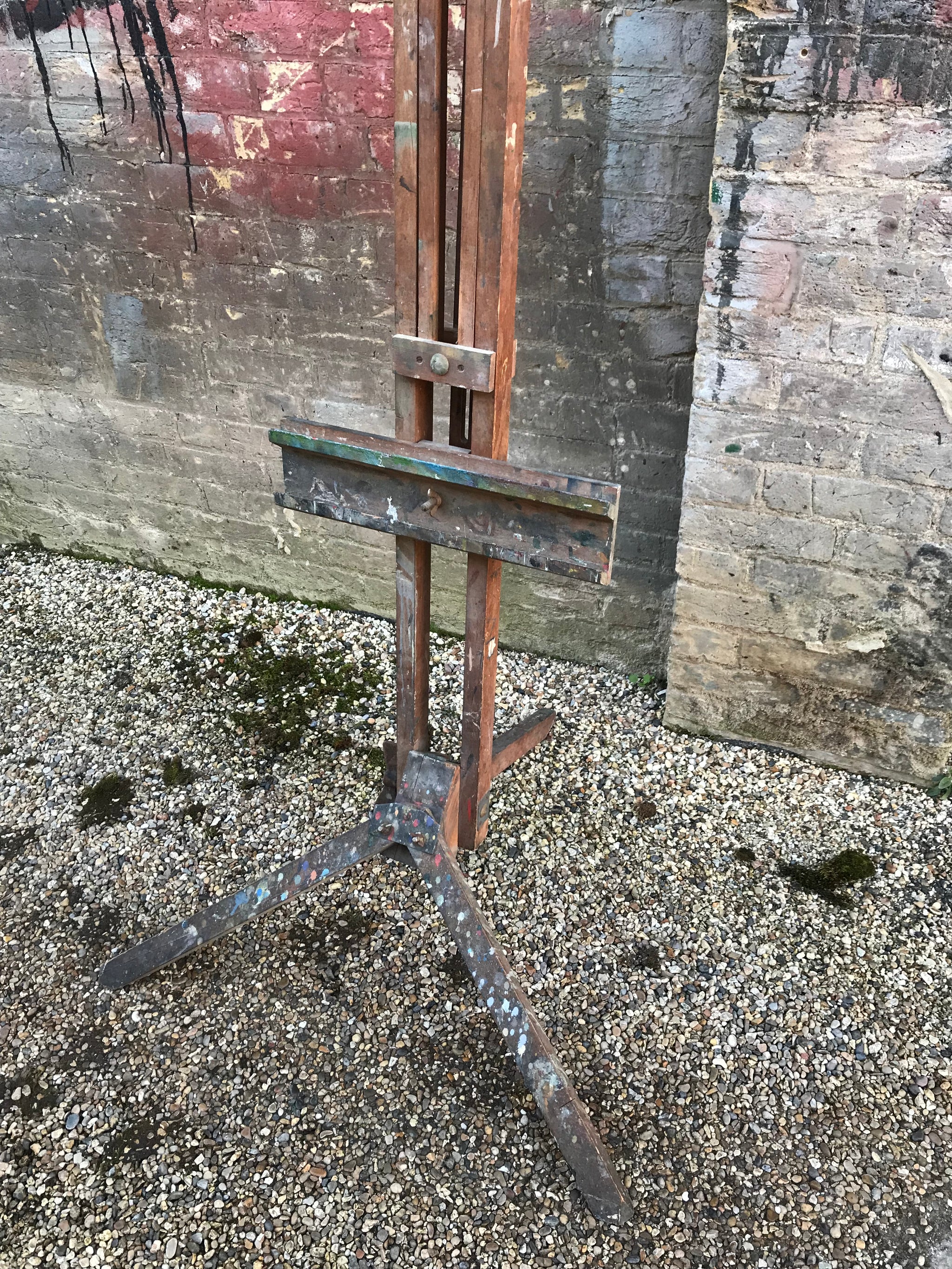 An oak floor standing studio artists easel