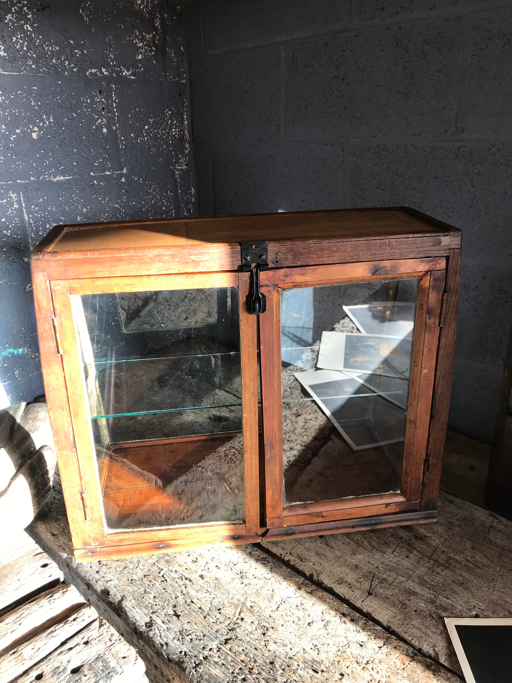 A sloping counter top glass shop display cabinet