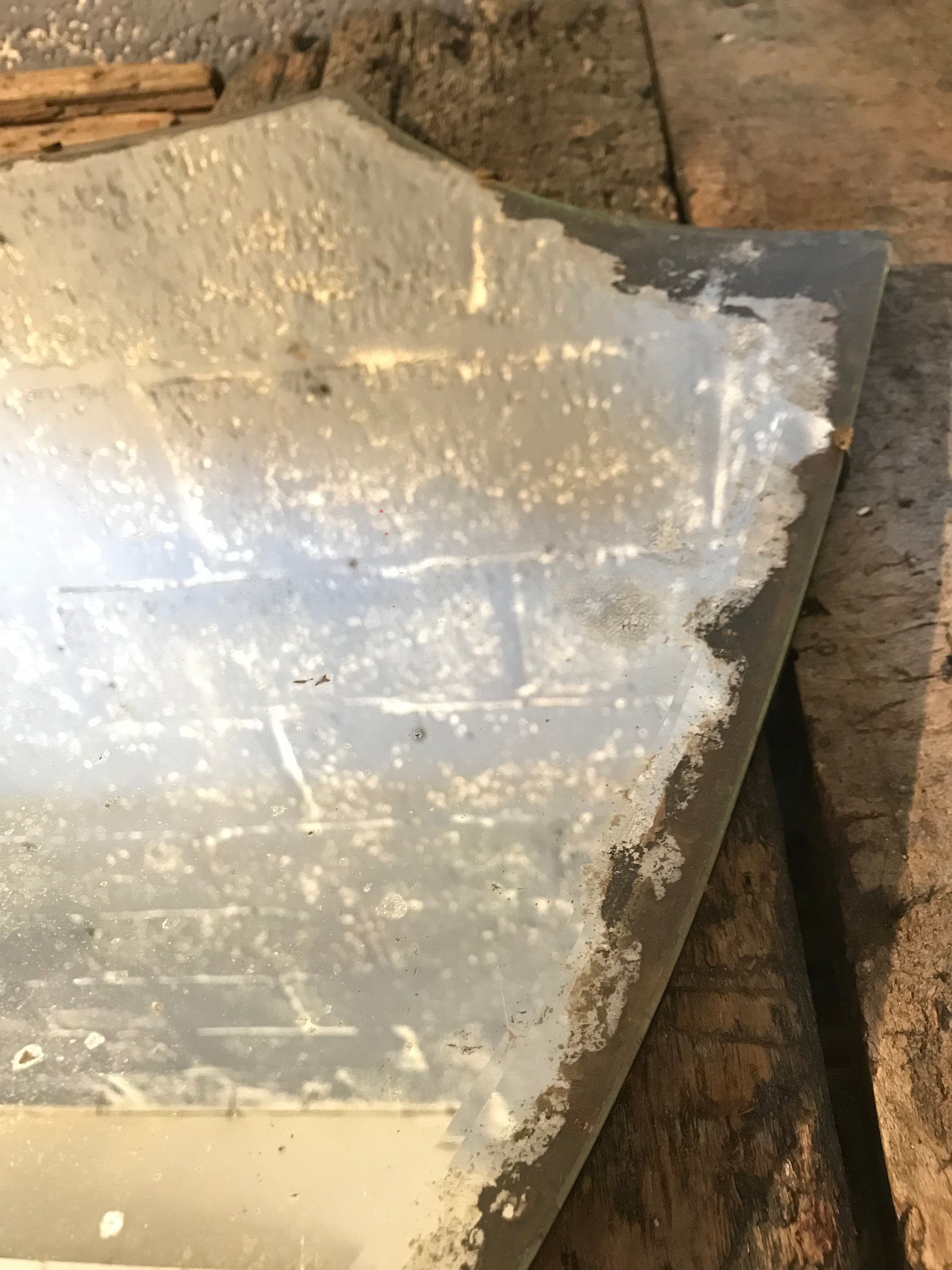 A large shield design bevelled Art Deco mirror